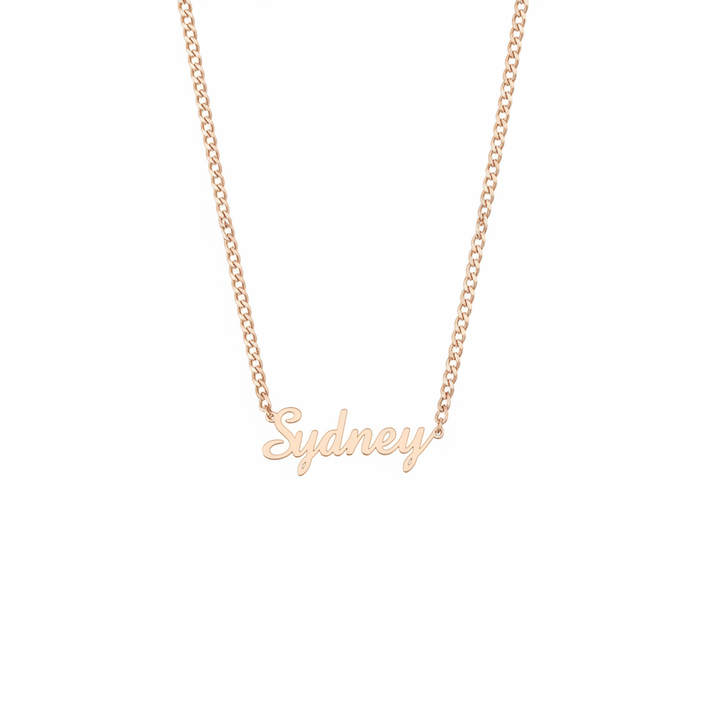 Rose gold script name Cuban link necklace on white background