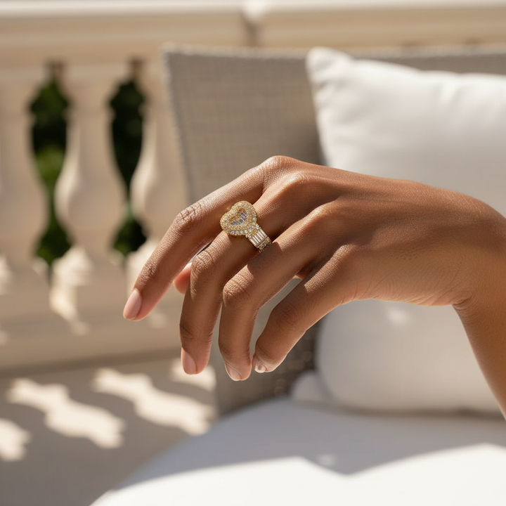 Gold baguette bypass ring worn on hand, lifestyle editorial shot
